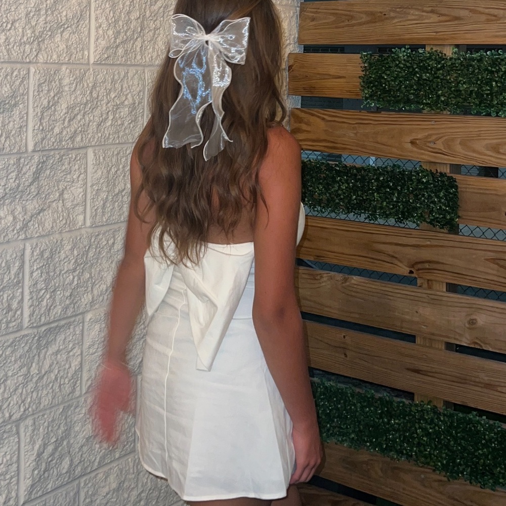 White Altard State mini backless bow dress. Perfect for a bride/bachelorette